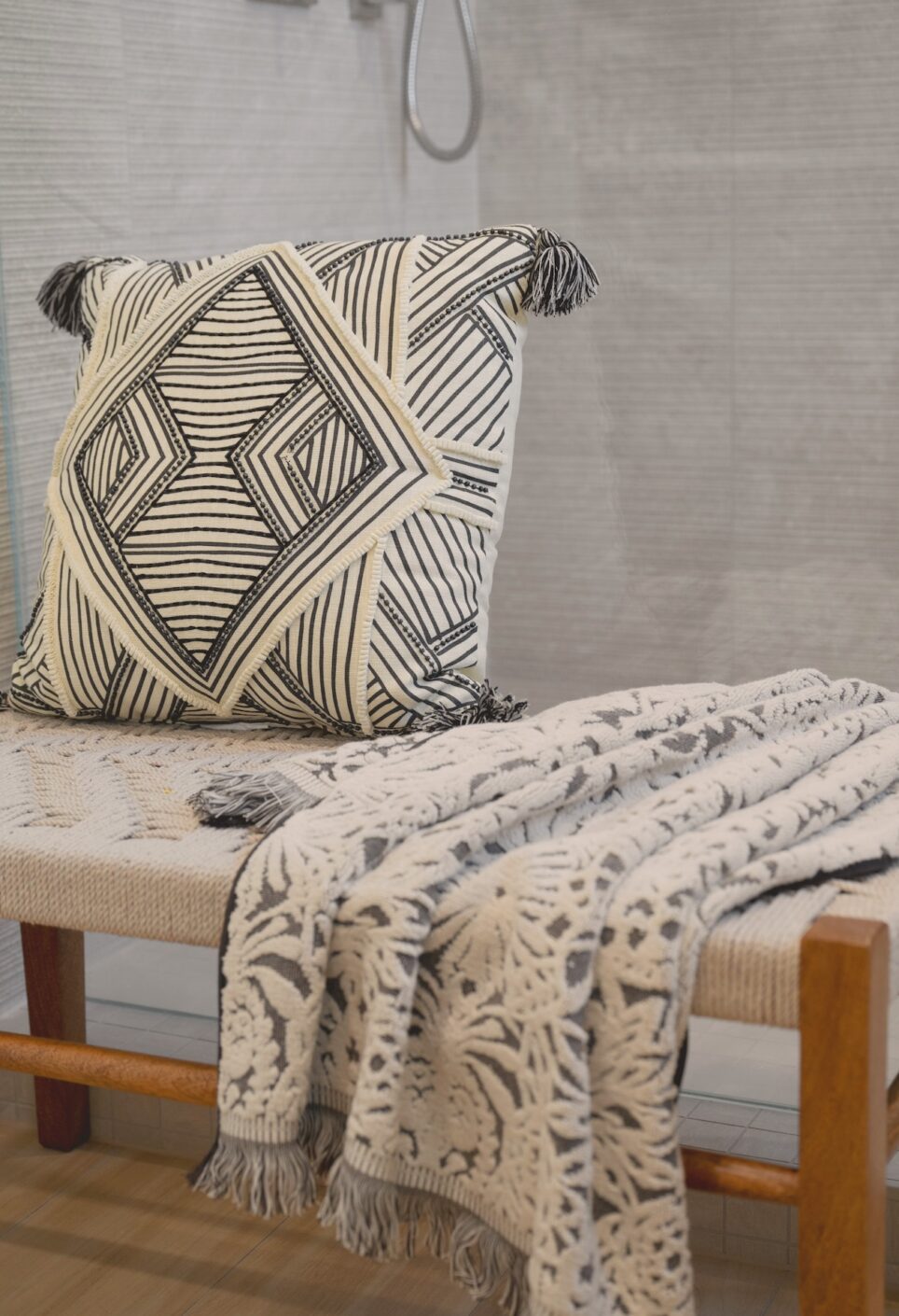 Bench With Accent Pillow And Blanket Primary Bathroom