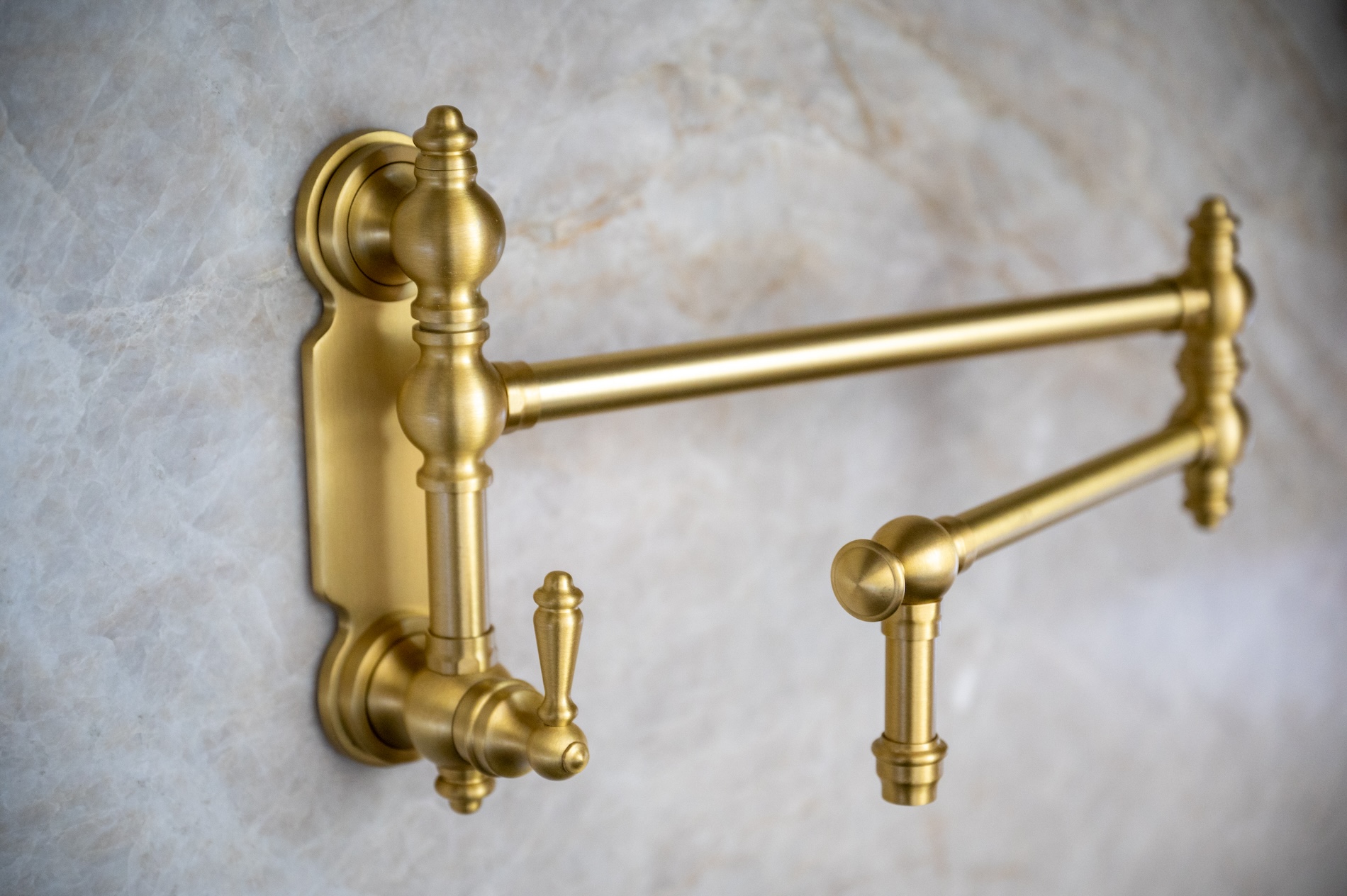 Gold Pot Sink With Marble Backsplash