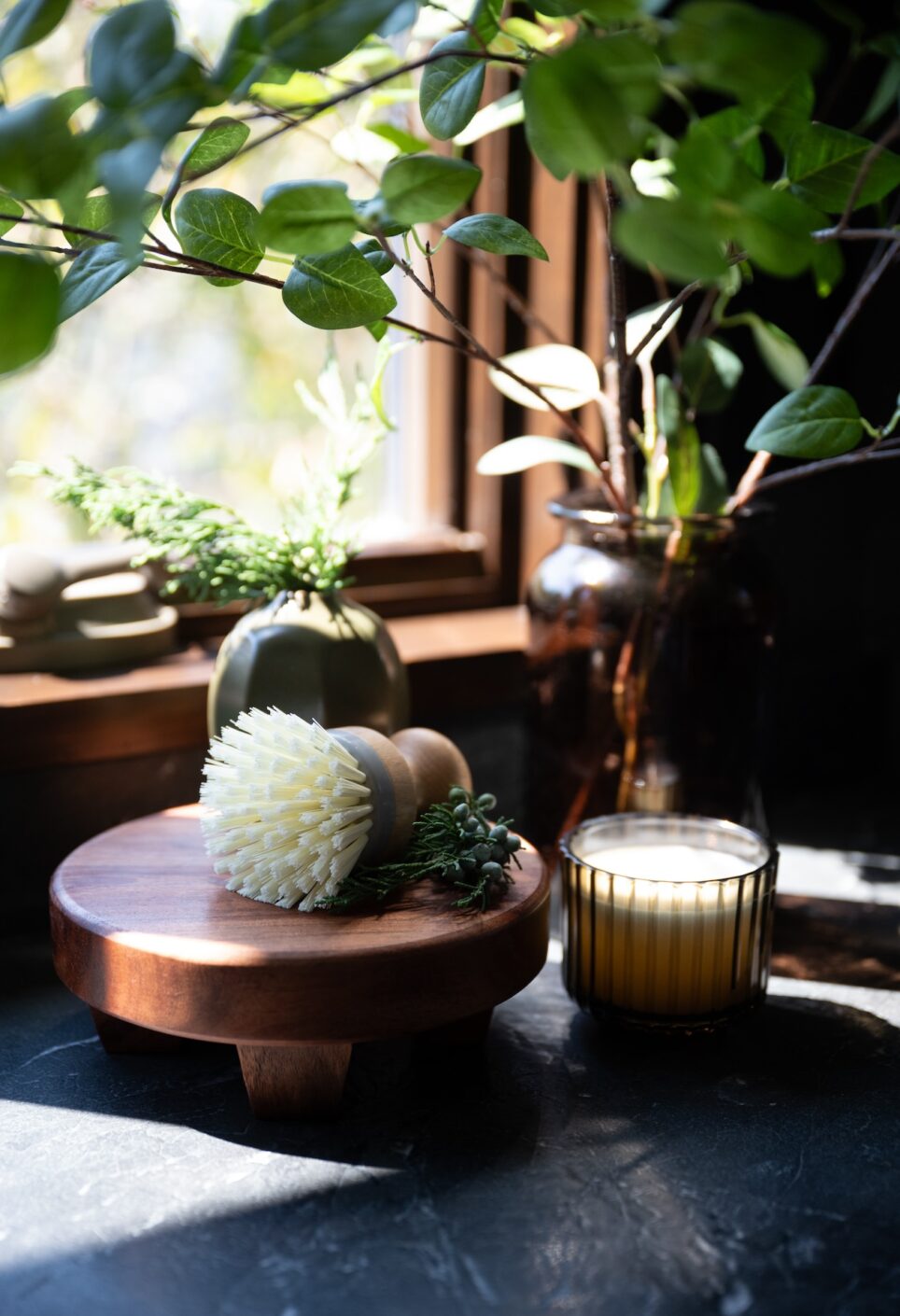 Kitchen Brush And Candle With Greenery In Vase