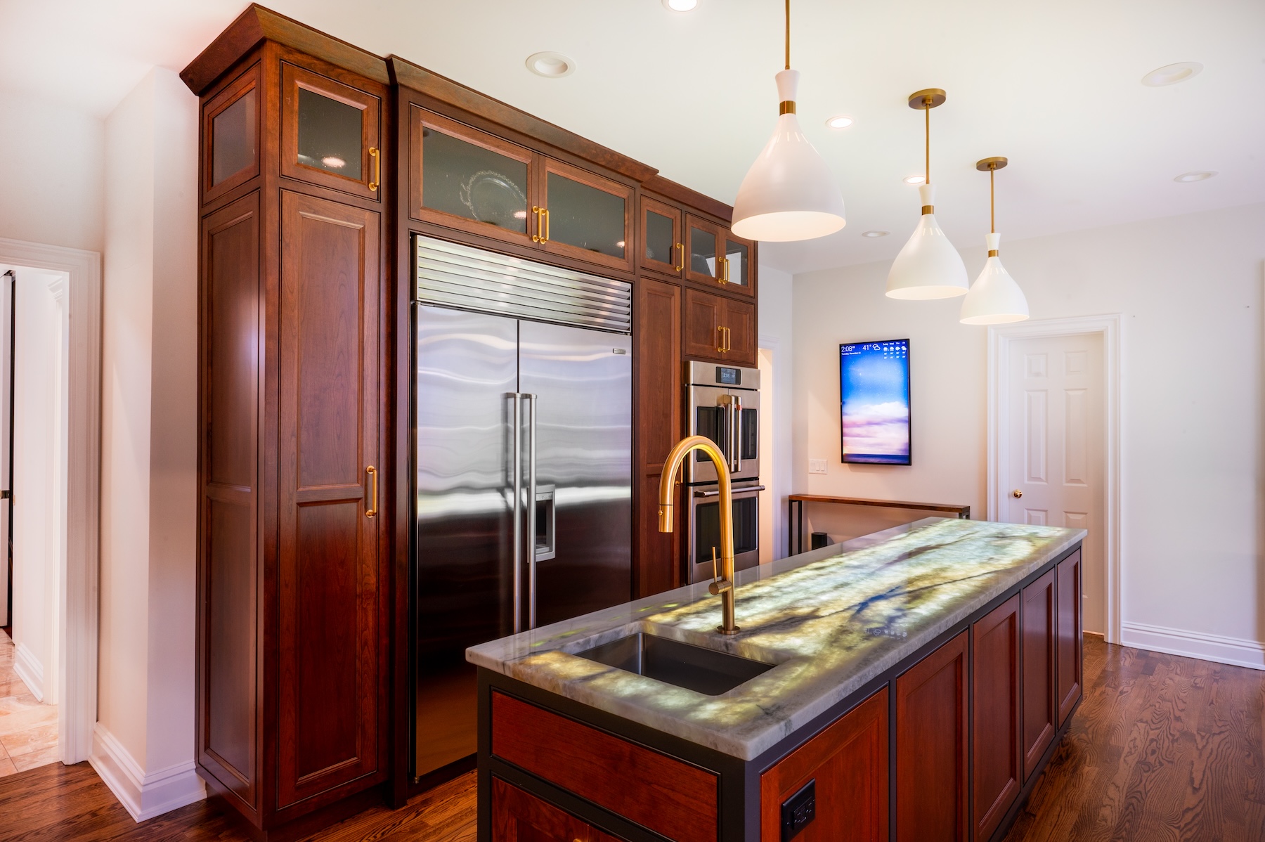 Marble Countertops And Cherry Cabinetry Kitchen