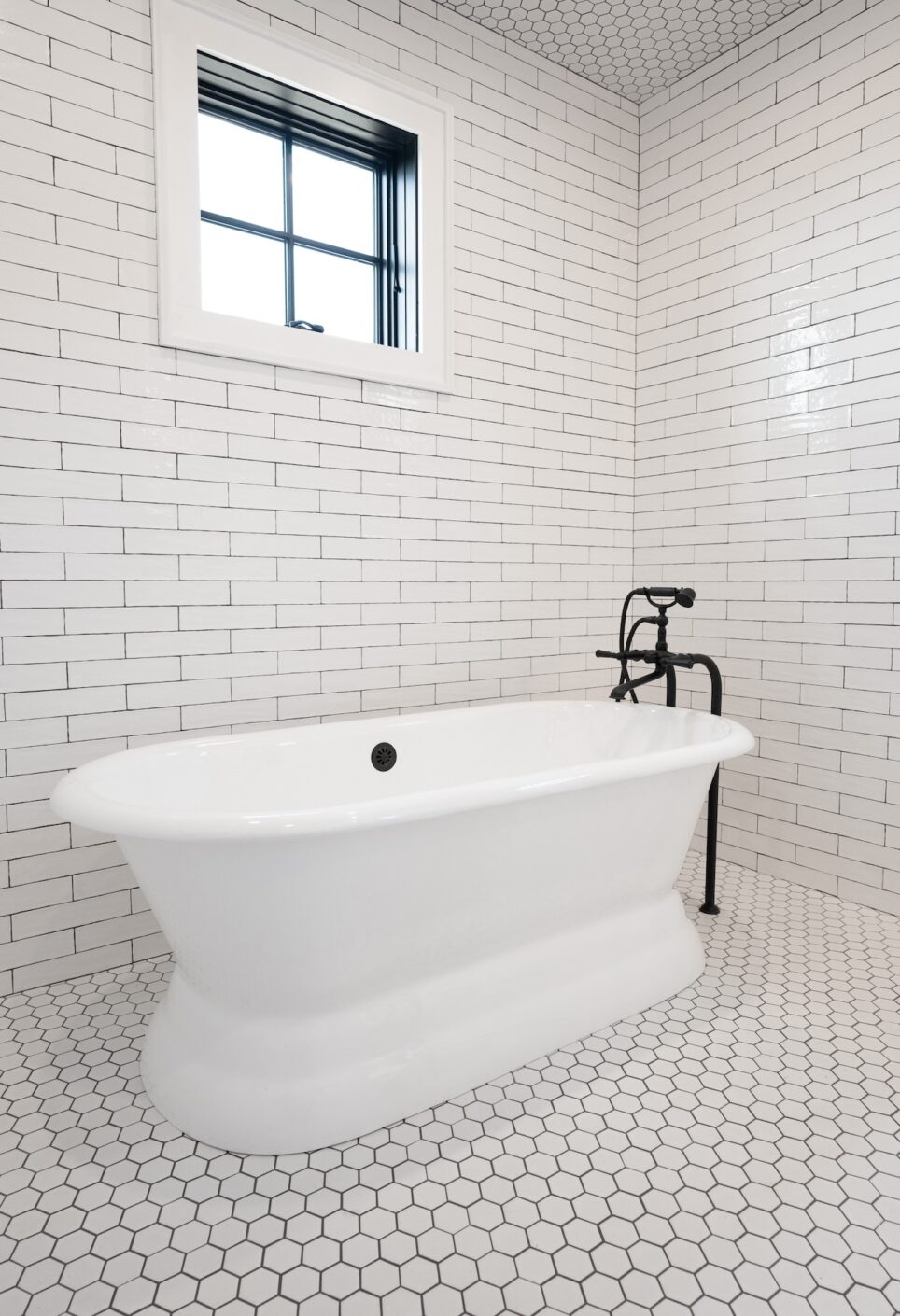 Primary Bathroom Bathtub Floor To Ceiling Tile